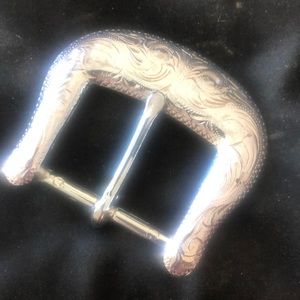 Silver tone belt buckle. Add to your favorite belt.  Nice design